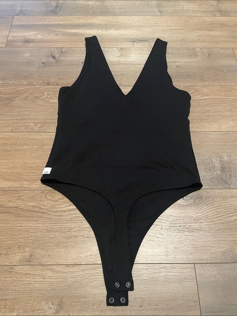Vuori Black V-Neck Sleeveless Bodysuit